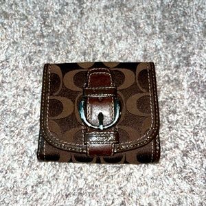 Coach bi-fold chocolate brown wallet.